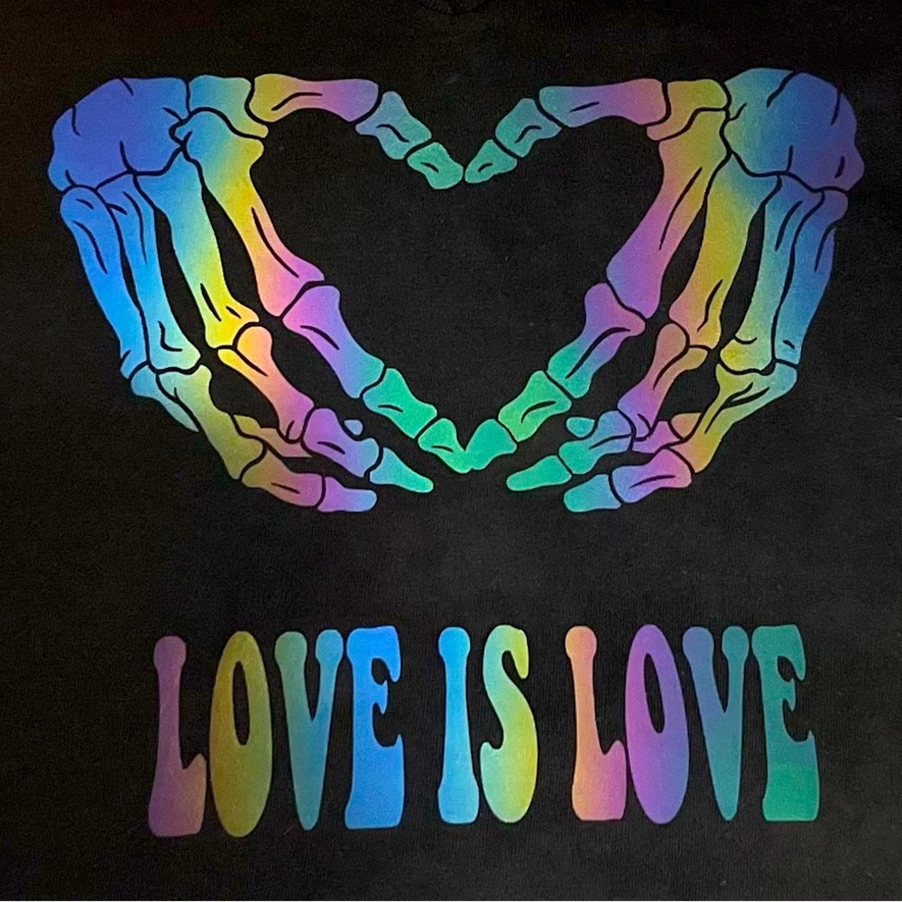 Large black V-neck tshirt “love is love”